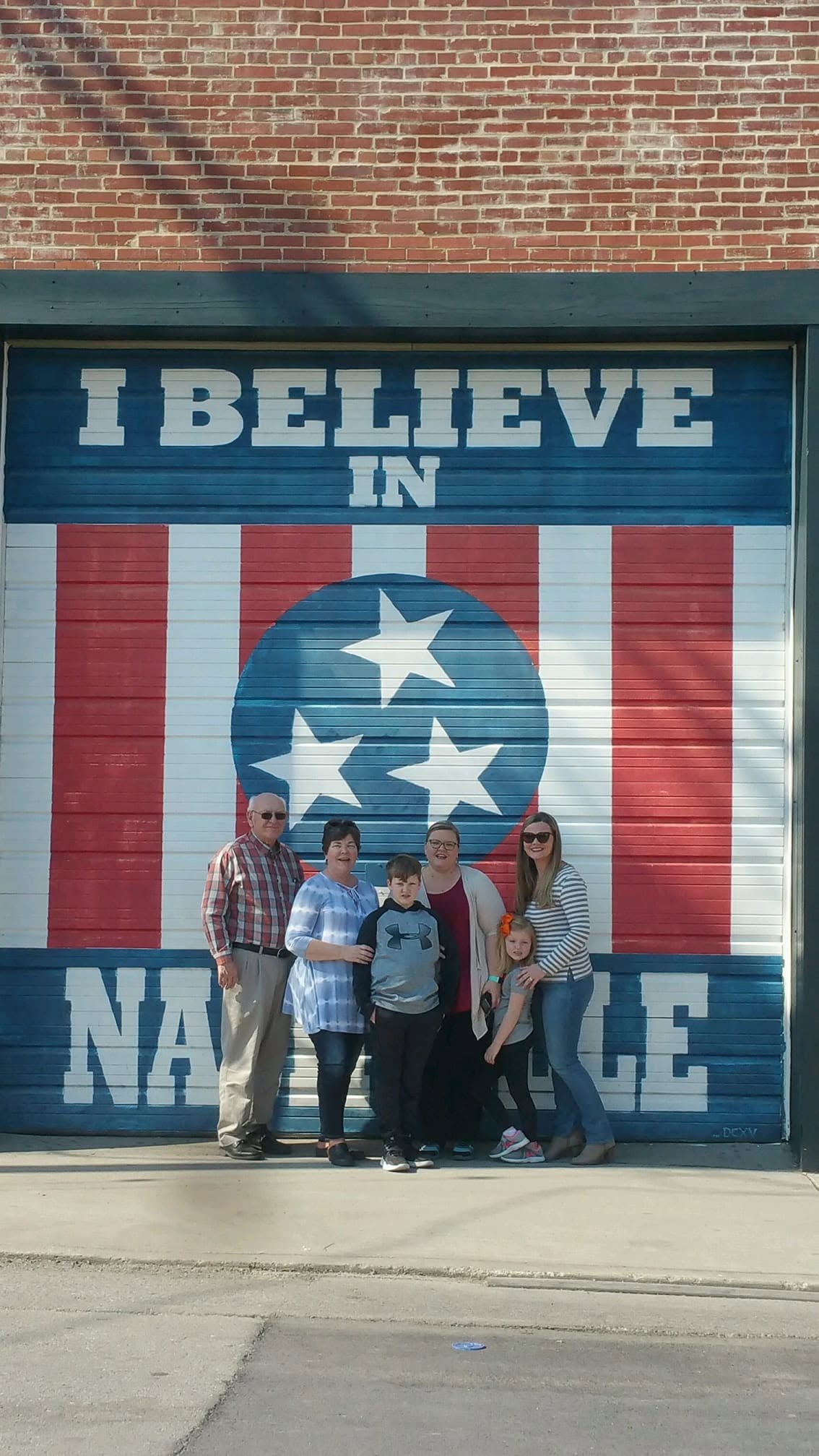 Jeremy Durham and his family at the I Believe in Nashville mural